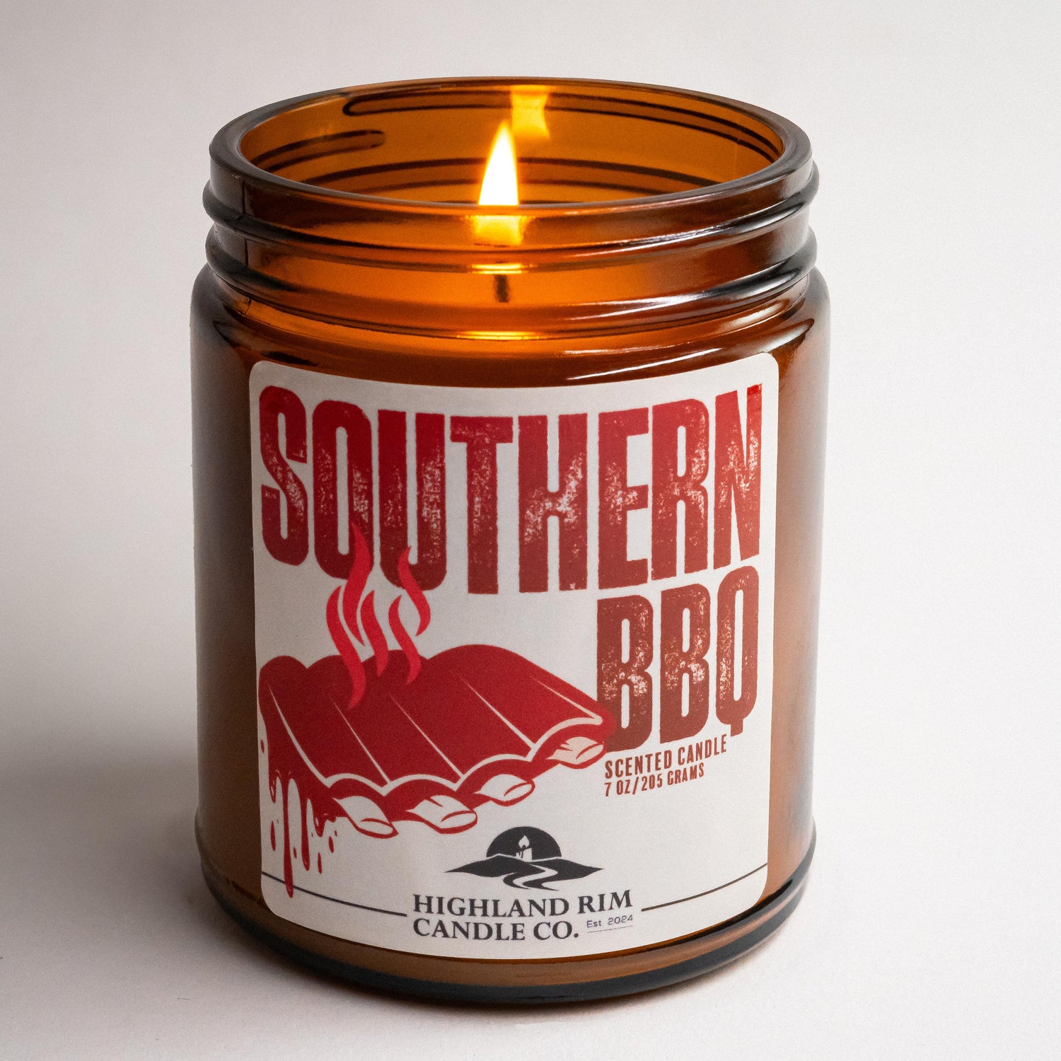 Southern BBQ candle lit, evoking warmth and comfort, with Highland Rim Candle Co. branding.