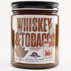 Square studio image of the Whiskey & Tobacco candle by Highland Rim Candle Co., featuring a bold brown label with illustrations of a tobacco leaf and a whiskey glass.